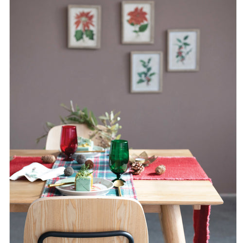 Linen blend runner in the color red displayed on a holiday themed dining table.