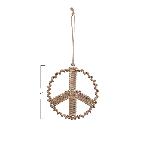 Peace sign ornament made of mango wood and rattan measures 4" high. 