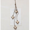 Antique brass finished hearts hanging on a jute string.