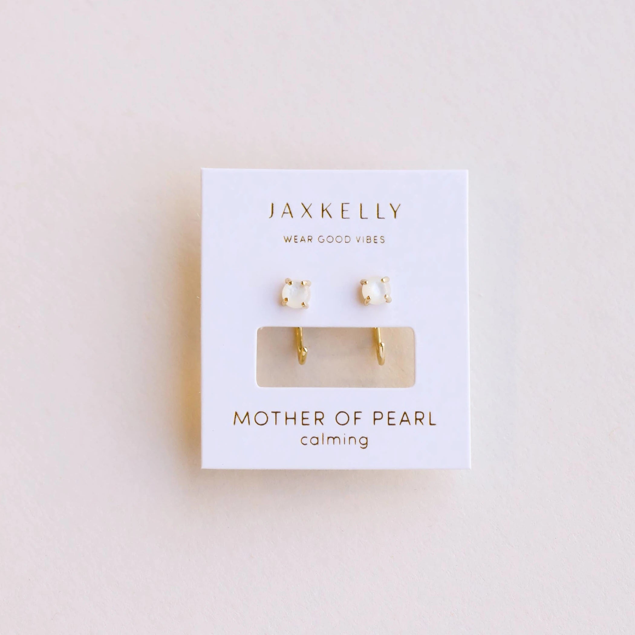 JaxKelly mother of pearl huggies earrings. 
