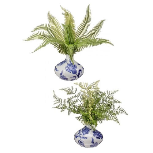 Natural mixed artificial ferns in bud vase.