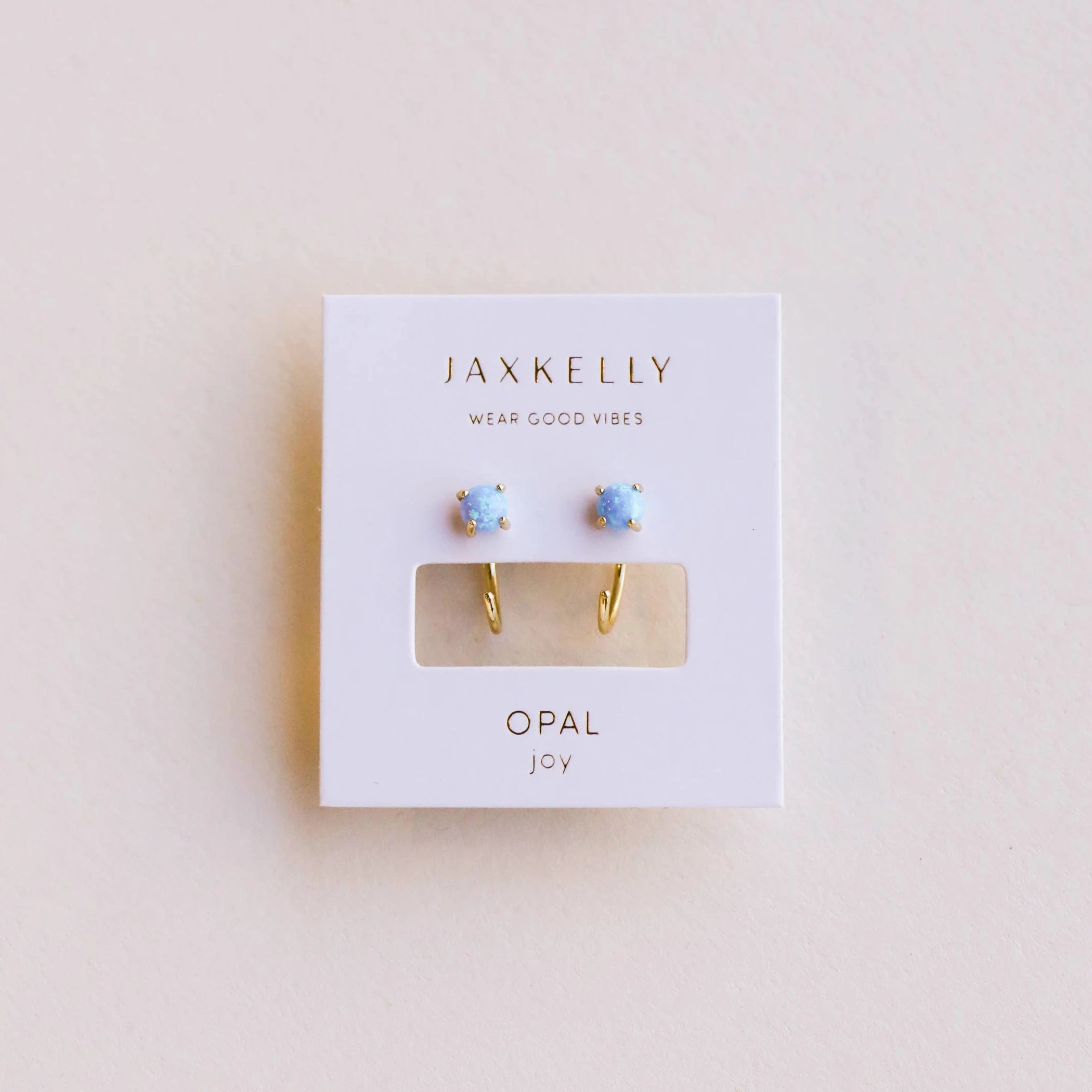 JaxKelly opal joy huggies earrings. 