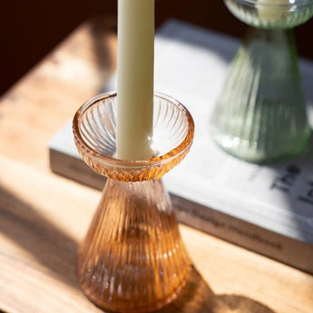 Close up view of the orange glass vase.
