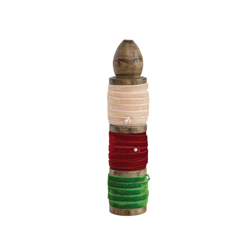 Ivory, red and green velvet ribbon wrapped around a stained wood spool.