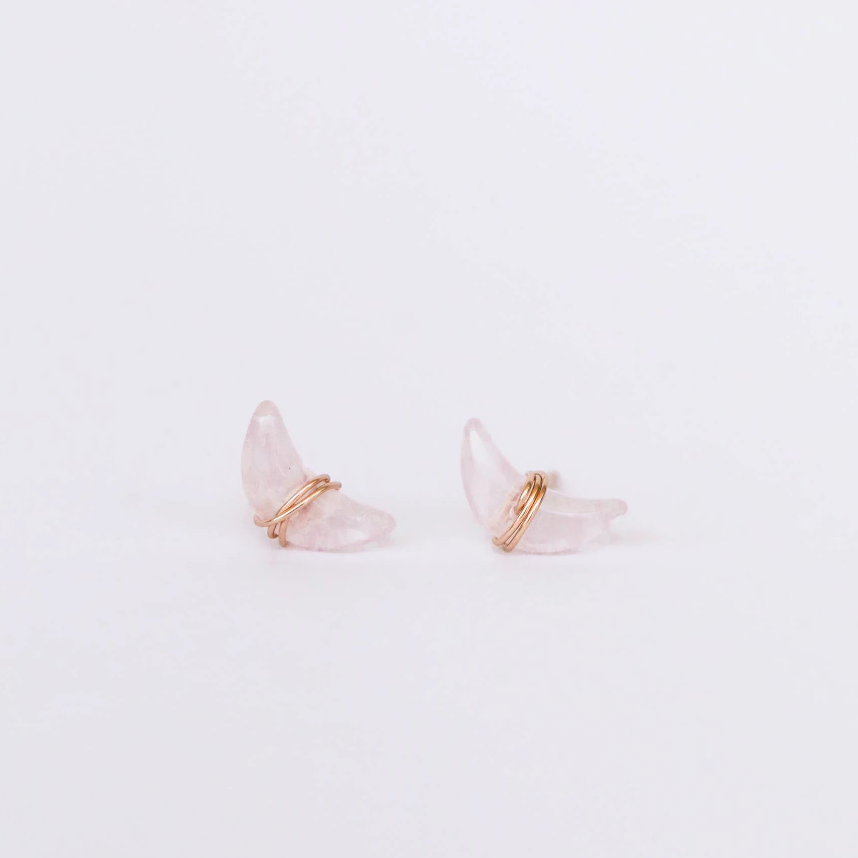 Wrapped rose quartz moon earrings.