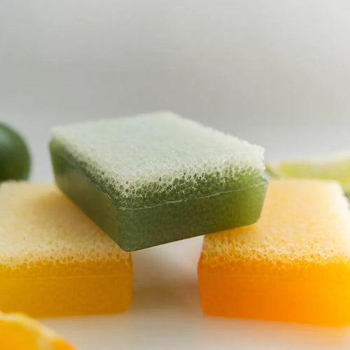 Lemon lime, lemon and orange scented Scrubby Soaps stacked. 