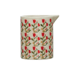 Hand painted wax relief flower creamer.