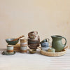 Abode collection featuring green glazed ceramics.