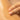 Close-up of a hand applying a skincare product to skin