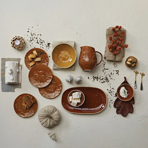 Fall stoneware tablescape with plates and dried florals. 