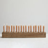 Wood taper holder with candles.