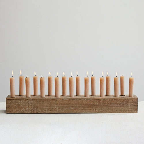 Wood taper holder with candles.