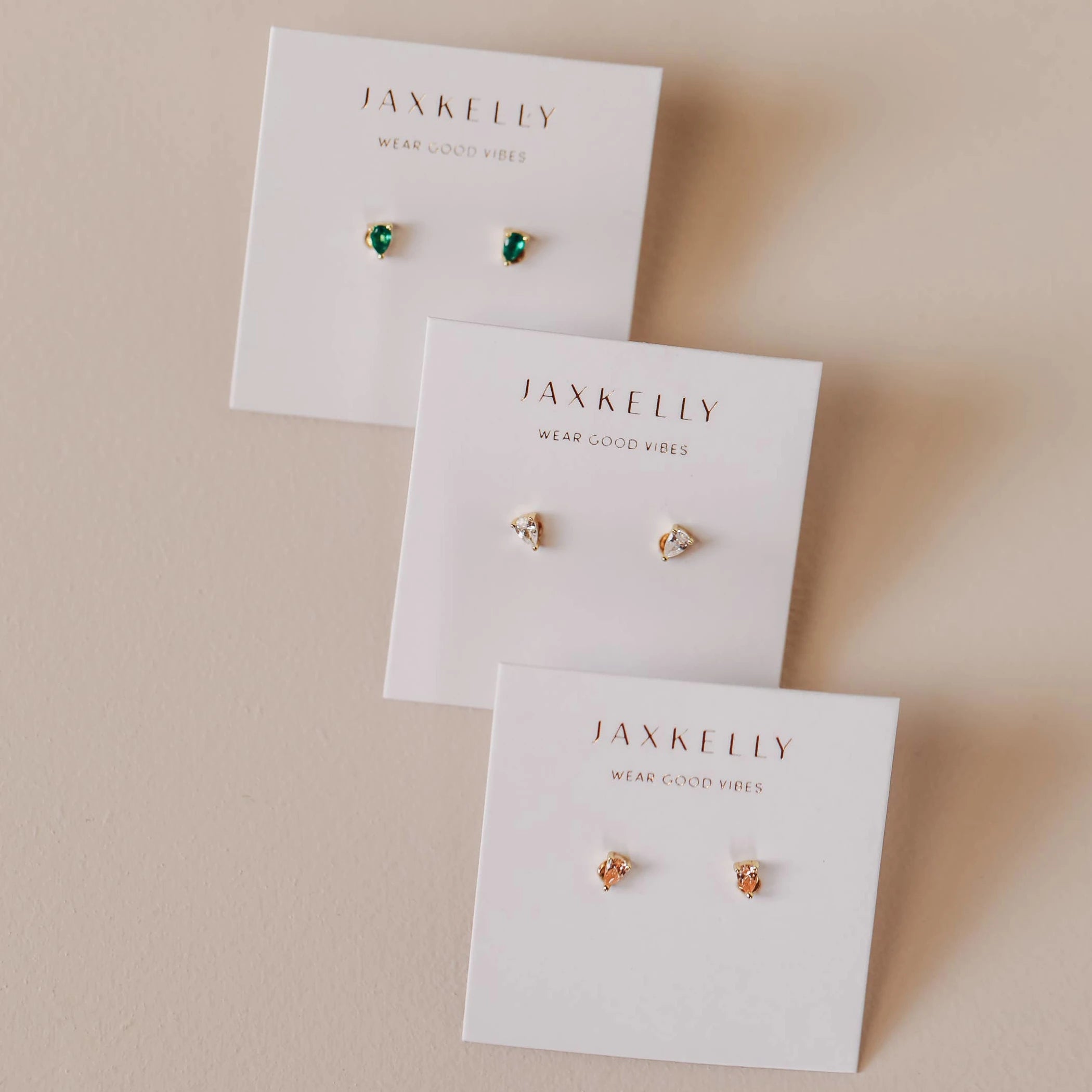 Three different colors of the champagne teardrop stud earrings.