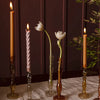 Raywood Budvases in various sizes and colours holding candles and flowers.