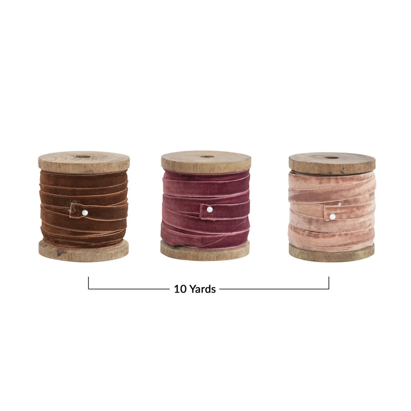 3 spools of velvet ribbon measure a total of 10 yards together. 