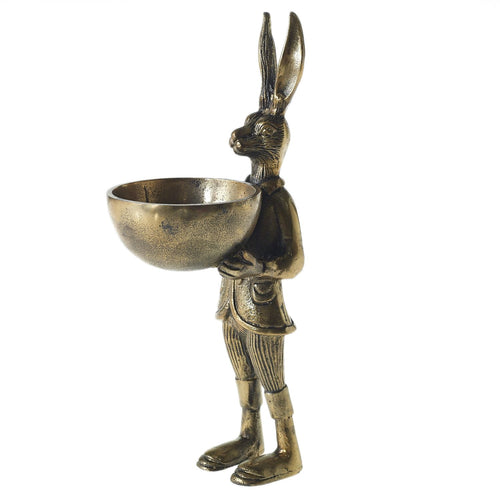 Antique Brass Hare Stand holding a bowl.