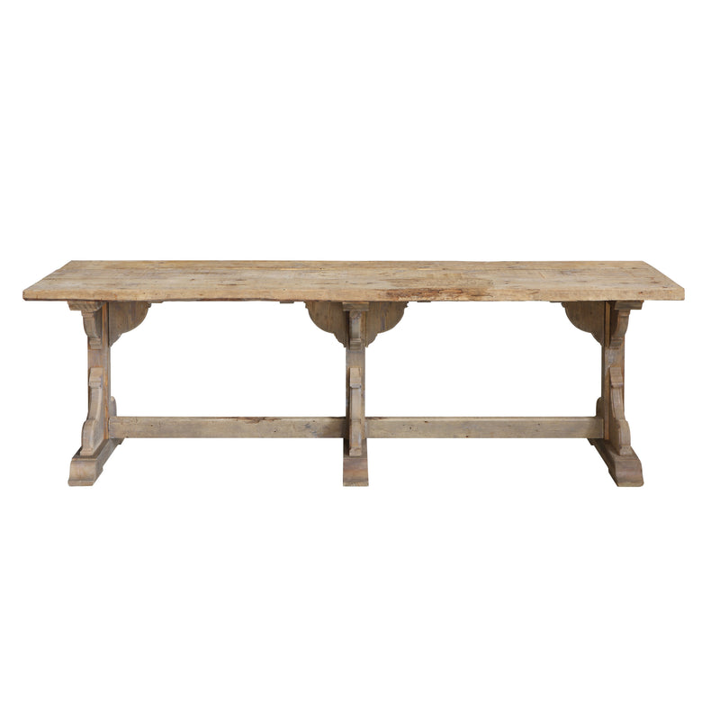 Reclaimed and distressed solid wood dining table with detailed legs. 