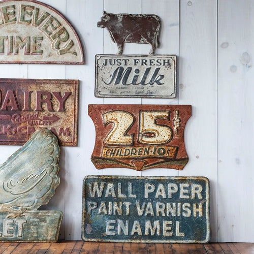 Vintage reproduction metal signs with patina and rustic appearance, 