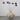 Handmade paper mâché vase with bubble texture styled with purple alliums towering out of the top.