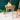 Mango Wood Accent Table against a dark green shiplap wall